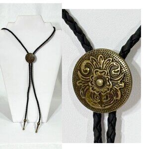 Gold-tone and black cord bolo tie.